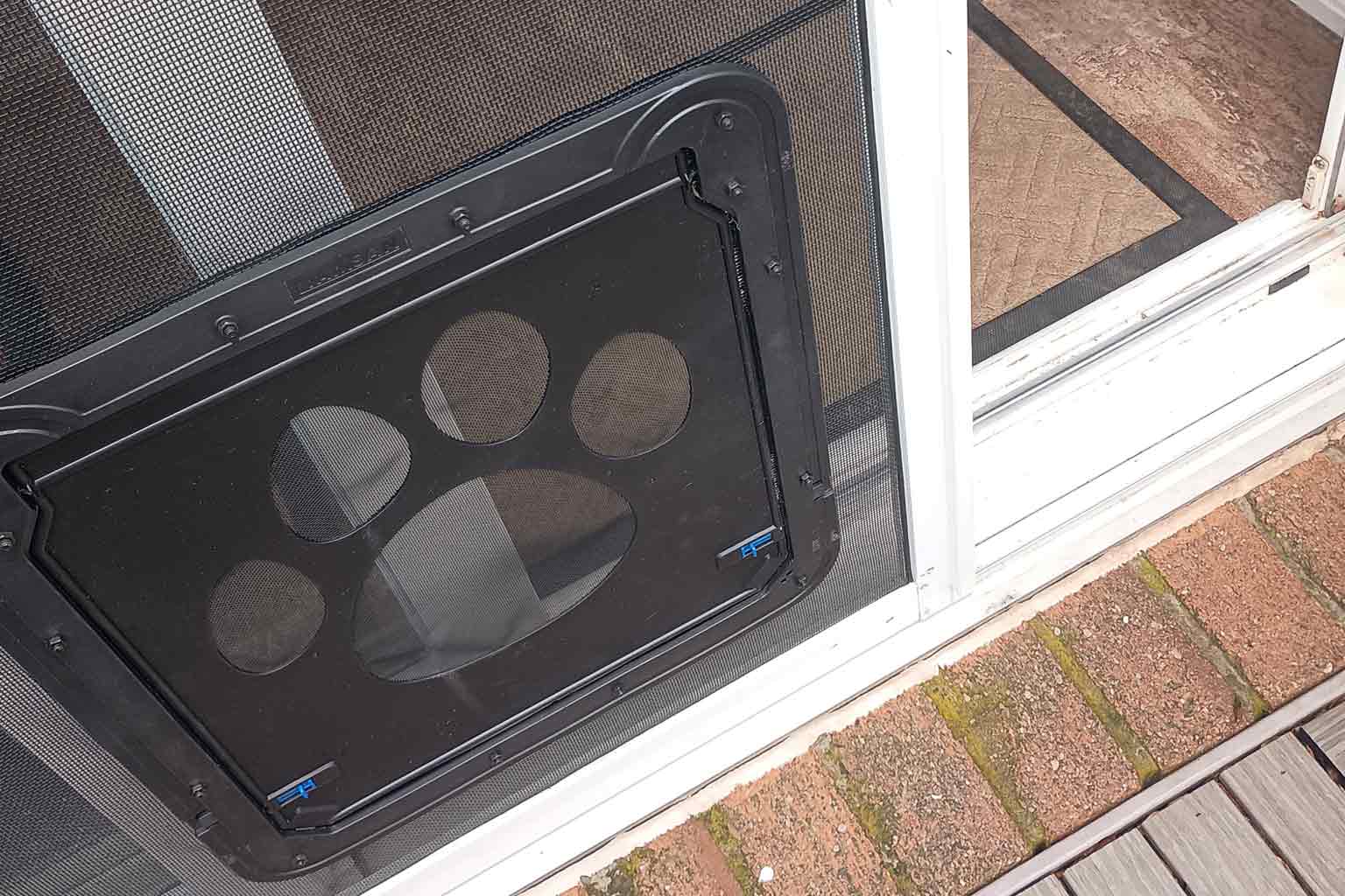 We install dog doors on screen doors